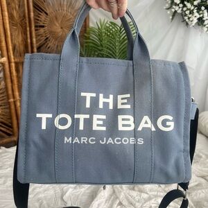 The tote bag purse 
Blue and black 
Has some discoloration
Marc Jacobs